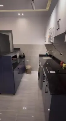 a kitchen with black counter tops in a room at Humbra in Hurghada