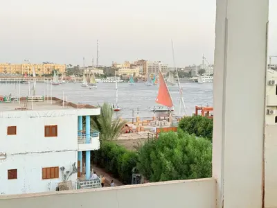 a view of a harbor with boats in the water at Qasr El Nil in Luxor