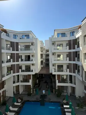 an aerial view of an apartment complex with a swimming pool at Imperial Resort App 433 in Hurghada