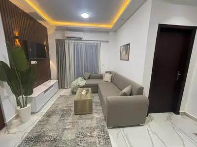 a living room with a couch and a table at اوسيس مارينا in Hurghada