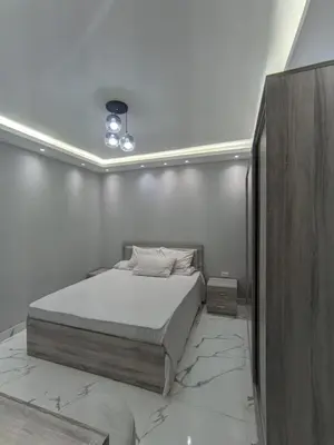 a bedroom with a bed with a marble floor at Avin Resort in Hurghada