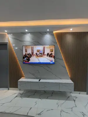 a flat screen tv on a wall in a lobby at Avin Resort in Hurghada