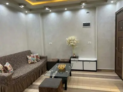 a living room with a couch and a table at flat in Hurghada Sheraton Street in Hurghada