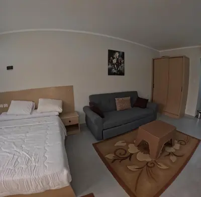 a living room with a bed and a couch at Sea La Vie Furnteched, Central, Beach Front, Free WIFI in Hurghada