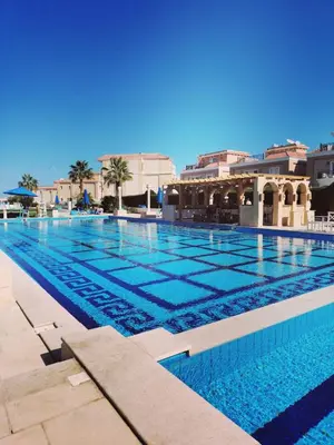 a large swimming pool with blue water at Selena Bay in Hurghada