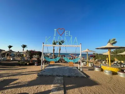 a playground on the beach with a sign that says love island at Family-Friendly Studio, Beach and Pools Access in Hurghada