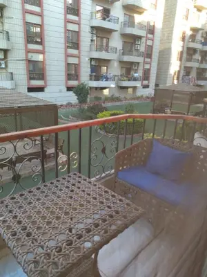 a bench sitting on top of a balcony at Luxor Resort in Al Bayāḑīyah