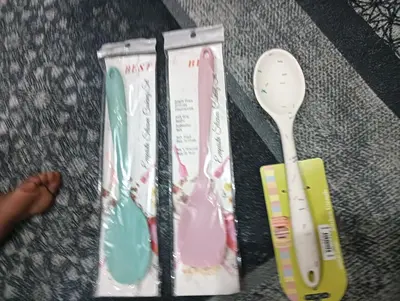 a plastic spoon and a toothbrush in a package at noreno house in Shellal