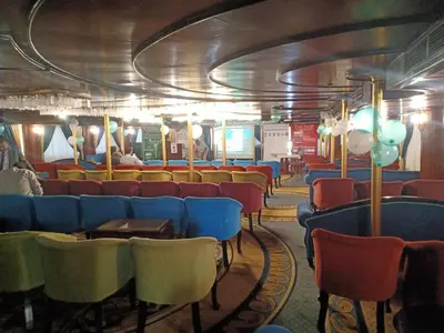 a train car with many chairs and a tunnel at فندق نايل ايليت سوهاج in Qilfāw