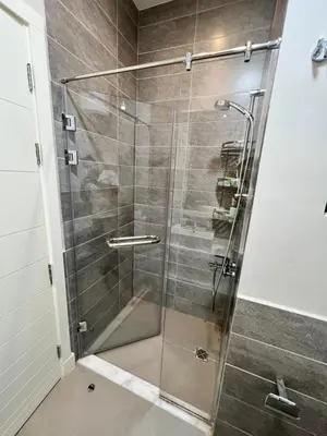 a shower with a glass door in a bathroom at Cyan Lakefront 3BR Townhouse El Gouna in Hurghada