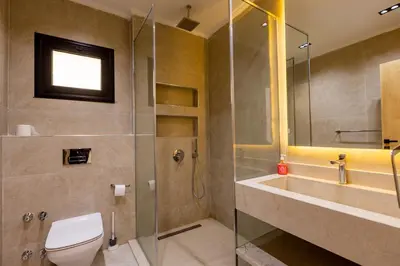 a bathroom with a shower and a toilet and a sink at private villa in Hurghada