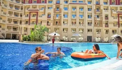 a group of people in the swimming pool at a hotel at florenza khamsin resort hurghada in Hurghada