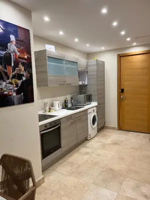 a kitchen with a sink and a dishwasher at Ground Floor 1 Bedroom Scrub Unit in El Gouna in Hurghada
