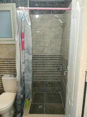 a bathroom with a shower and a toilet at Sherathon studio Sheri in Hurghada