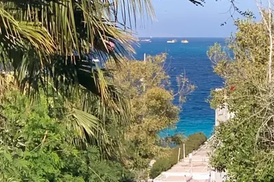 a road with the ocean in the background at Beachfront 3-Bed Sleeps 6 with Sea View in Hurghada