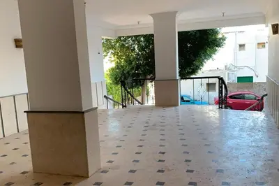 an empty room with a porch with columns and tile floor at Beachfront 3-Bed Sleeps 6 with Sea View in Hurghada