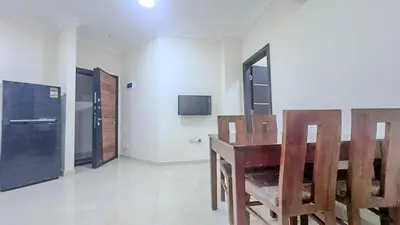 a dining room with a wooden table and chairs at La Quinta Beach Resort in Hurghada in Hurghada