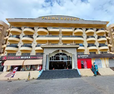 a large building with steps in front of it at cozy sea view apartment palma resort in Hurghada