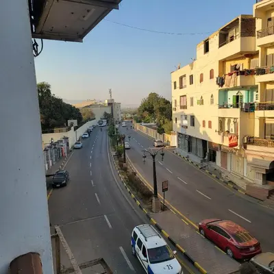 a view of a street with cars and buildings at OS & MA Luxor APT in Luxor