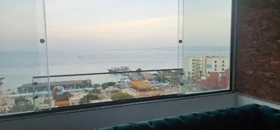a view of the ocean from a room with a window at Sea view Penthouse sea front city center 11 in Hurghada