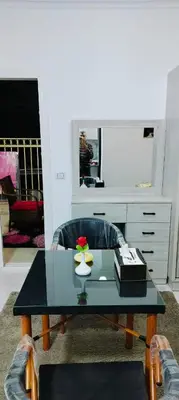 a living room with a coffee table and a desk at Gamal in Hurghada