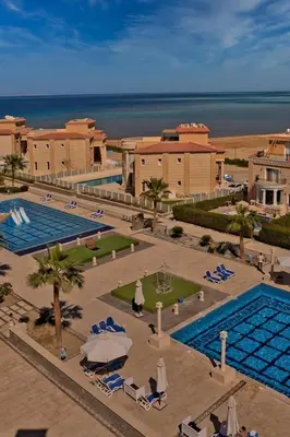 an aerial view of a resort with a swimming pool at Sea-Front Selena Bay Resort Apartment in Hurghada