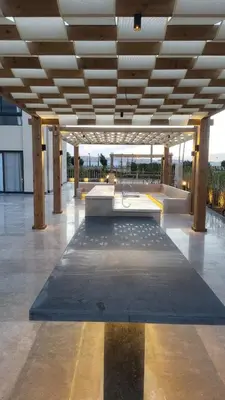 a large building with a bench in the middle at Elgouna -4 bedroom villa with private heated pool in Hurghada