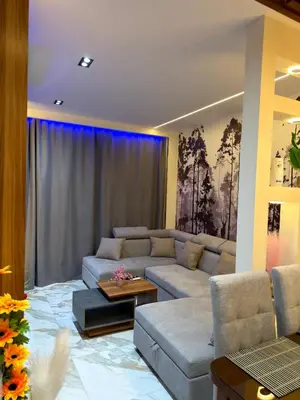 a living room with a couch and a table at Hurghada - European standard apartment for rent! in Hurghada
