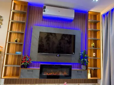a living room with a tv and a fireplace at Hurghada - European standard apartment for rent! in Hurghada