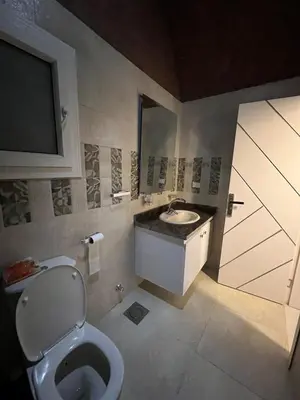 a bathroom with a toilet and a sink at Luxury Sea-View Rooftop with Private Terrace in Hurghada