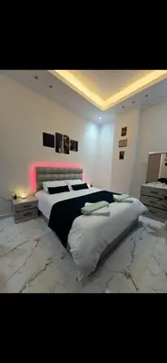 a bedroom with a large bed in a room at Ramses Apartment in Hurghada