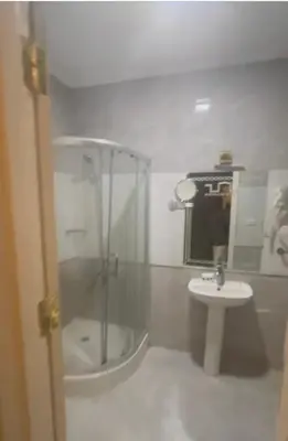 a bathroom with a shower and a sink at مول بلازا in Aswān