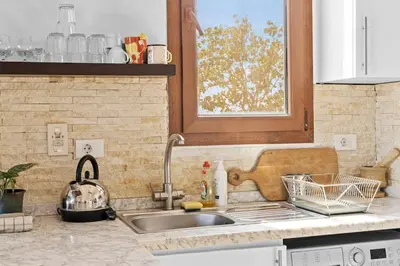 a kitchen counter with a sink and a window at South Marina Central 2BR, bathtub, Terraces & Pool in Hurghada