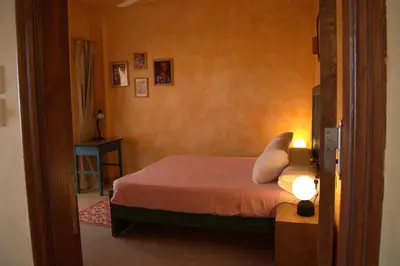 a bedroom with a bed with two pillows and a lamp at 36 Southwalk in Quseir