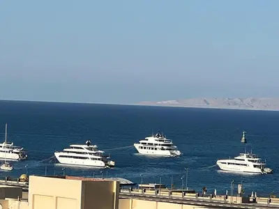 a group of boats floating in the water at Tiba golden resort in Hurghada