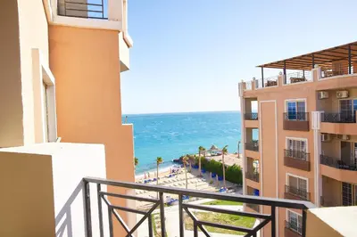 a view of the ocean from the balcony of a building at Juliana beach resort by V in Hurghada