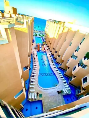 an aerial view of a swimming pool on the beach at Sea view studio for rent at Juliana at Hurghada in Hurghada