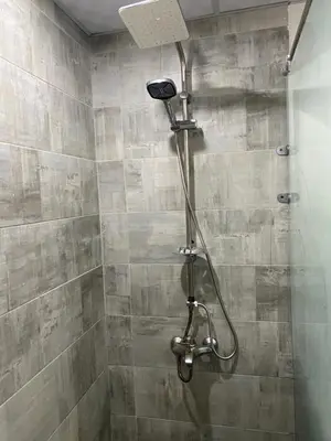a shower with a shower head in a bathroom at Hurghada scandic resort in Hurghada