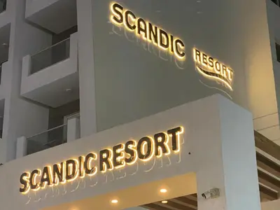 a sign for a seafood restaurant on the side of a building at Hurghada scandic resort in Hurghada