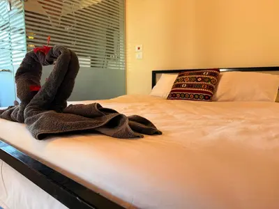 a towel is sitting on a bed at Citadel Luxor in Luxor