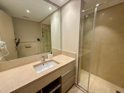 a bathroom with a sink and a shower at Cozy 2BR Plus Nanny - Free Beach&Pool In Mangroovy ElGouna in Hurghada
