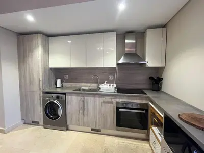 a kitchen with a sink and a dishwasher at Mangroovy -2BR GF Hacienda House Pool & Beach access in Hurghada