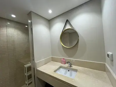 a bathroom with a sink and a mirror on the wall at Mangroovy -2BR GF Hacienda House Pool & Beach access in Hurghada