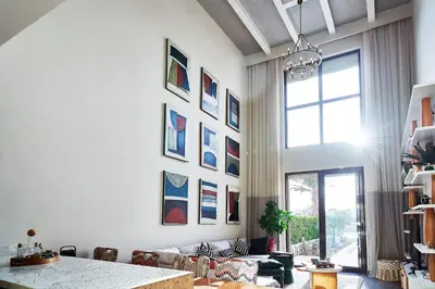 a living room with paintings on the wall at BYTK - La Serena in Hurghada