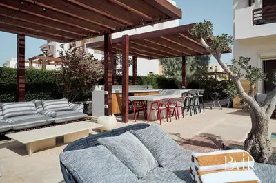 a patio with a couch and a table and chairs at BYTK - La Serena in Hurghada
