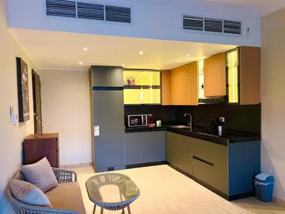 a kitchen with a sink and a counter top at Aldau Heights Hurghada Prestige Spacious Hotel-Style Poolview 1BR in Hurghada
