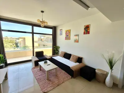 a living room with a couch and a table at Gcrips in El Gouna