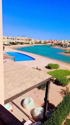a view of a resort with a swimming pool at Hayloft 1 bedroom tawila, Plaza ElGouna in Hurghada