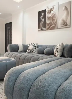 a row of blue couches in a living room at HUB resort Luxury apartment on the pool in Hurghada