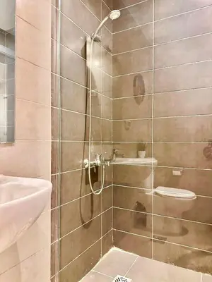 a shower with a glass door in a bathroom at El Gouna in Hurghada